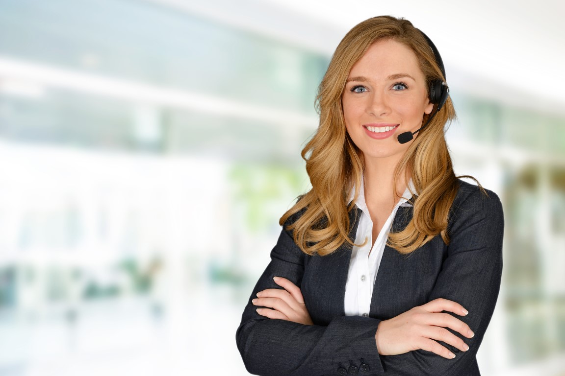 Young woman giving help as a customer service employee